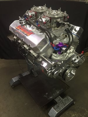 How about this Awesome Project. 584 Duel Carb 10 to 1 compression Pump Gas street engine. this 922 HP engine is going in a 57 chevy in Ohio. Notice the trick sheet metal intake and billet accessories.