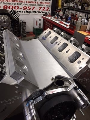 Here at Steve Schmidt Racing we handmade billet spacers & fabricated custom valley trays so we could adapt a A-460 Head to a C-Head Blower Manifold ?